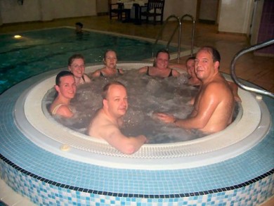 Picture of a group enjoying a dip in a jacuzzi.