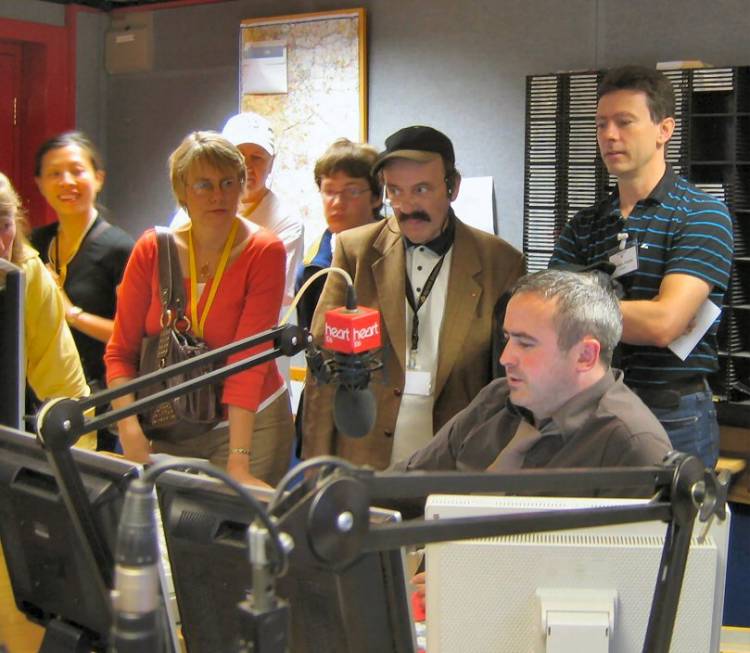 Picture of members in the radio studio