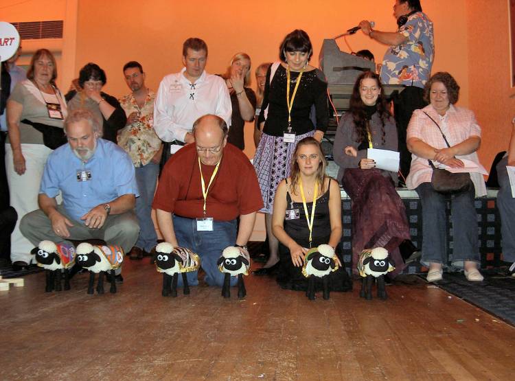 Picture of six toy sheep lined up ready for racing