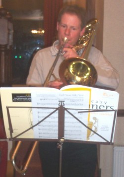 Picture of Alan playing the trombone.