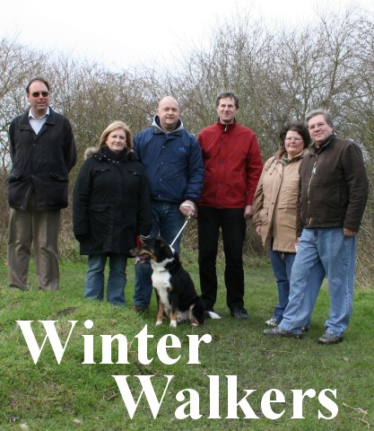 Winter Walkers: A group take a walk in Priory Park. See below.