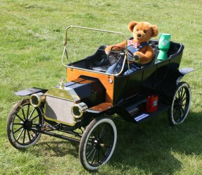 Teddy bear in a model model T Ford.