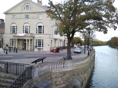 Photo of the Swan Hotel, embankment and river.
