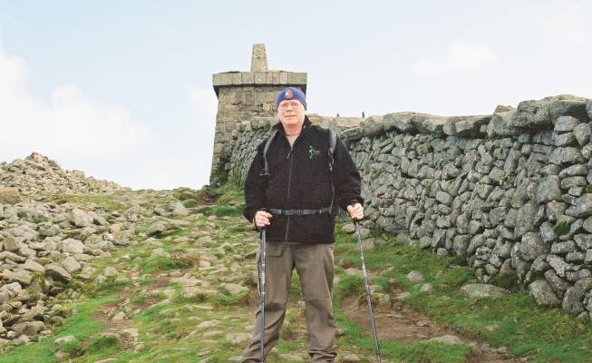 Ian Sargent poses at the summit of Slieve Donard