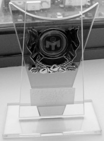 The newsletter award for service is a engraved glass plaque.