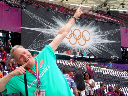 Neil stands in the celebratory pose of Usain Bolt.
