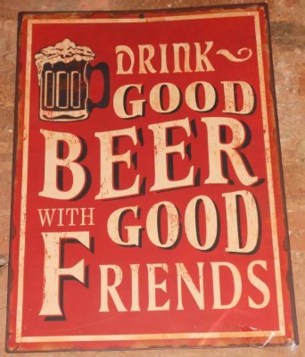 Sign from pub: Shows  a foaming jug of beer and reads 'Drink good beer with good friends
