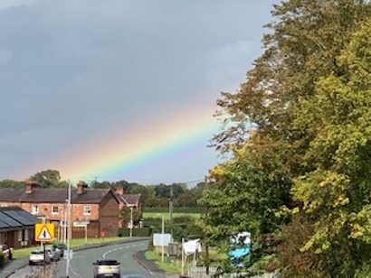 A rural scene, with a rainbow