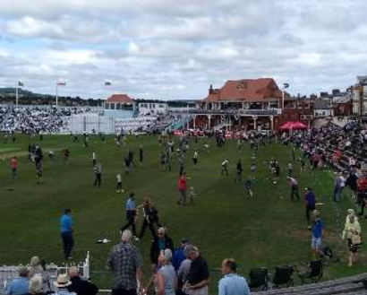 People on the cricket pitch at Scarborough