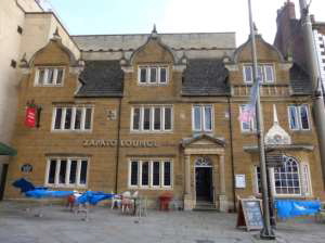 Front elevation of the Zapato Lounge shows a brick building on 3 floors