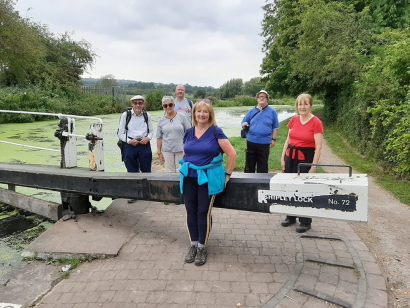 Members stand around the shipley lock gate