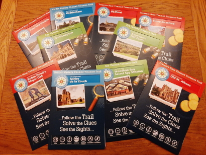 A display of guide packs to ten different treasure trails