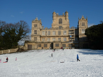 Snow covered slopes leading up to Wollaton Hall