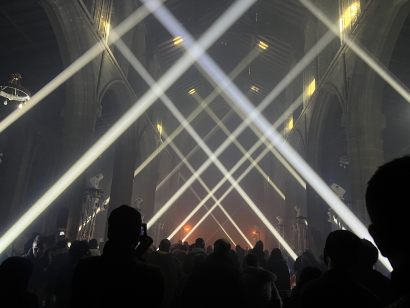 Beams of light criss-cross the inside of the church