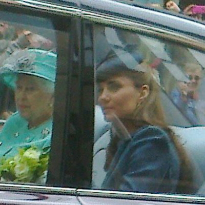 Queen Elizabeth II and the Duchess of Cambridge behind a car window