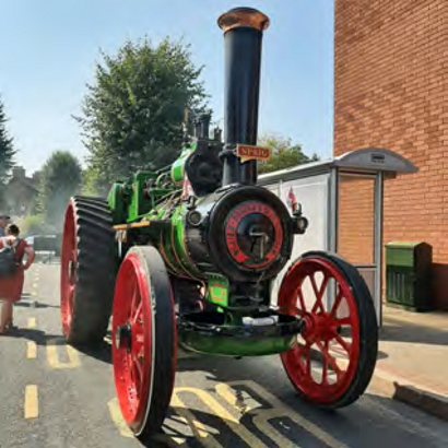 A bright red and green steam engine