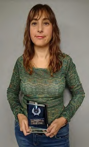 Maria poses with one of the awards