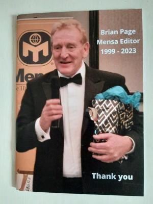 Brian Page, Mensa editor from 1999 to 2023, in black tie dress