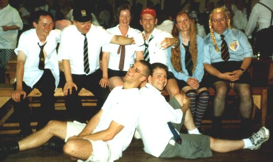 Picture of the group at the School Dinners event all dressed up in school garb, not necessarily all of the correct gender.