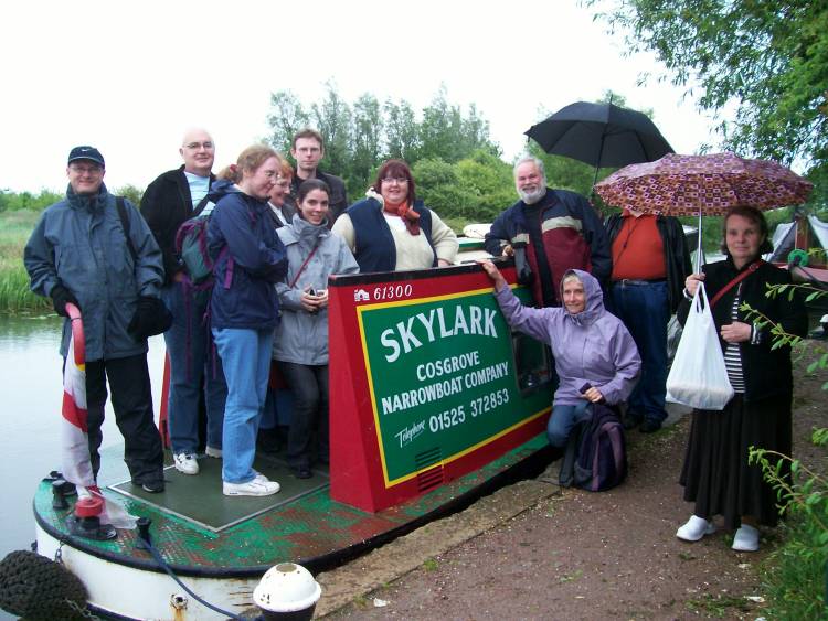 The group gather in the rain for the narrowboating trip