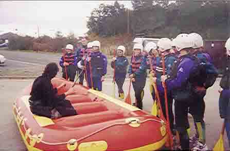 Picture of the rafters getting their safety instruction at the watersports centre.