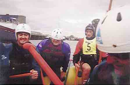 Picture of four rafters on the water.