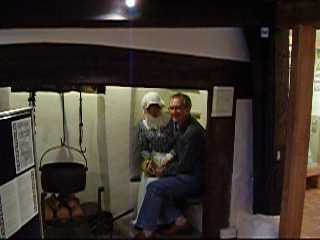 Picture of local Mensan Brian Beard getting "friendly" with one of the 
exhibits