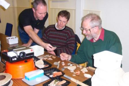 Picture of members study an array of material