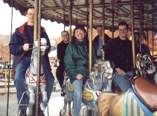 Picture of riders on a fairground carousel