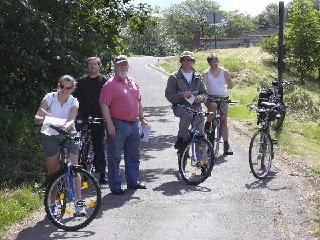 Picture of members on a rest stop along their cycle ride
