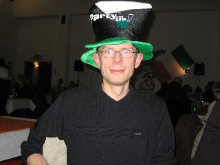 Picture of Paul Henchliffe in a hat that looks like a pint of Guinness