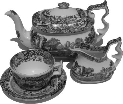 A teapot, cup and saucer and a milk jug
