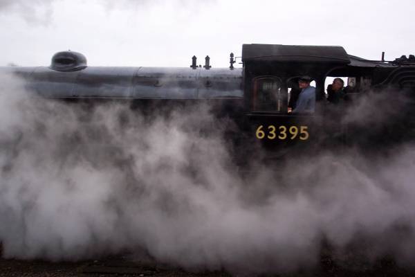 The Q6 steam locomotive 63395 is almost lost in its own steam.