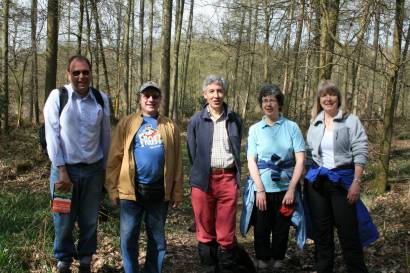 Five members from the south-east part of the region pose for the camera on their walk, with a wooded background.