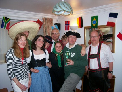 Picture of the group, dressed in a range national costumes.